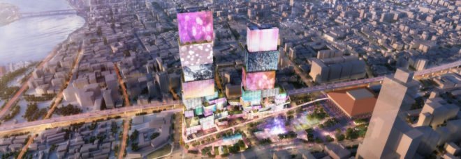 aerial rendering of towers with media screens as the facades