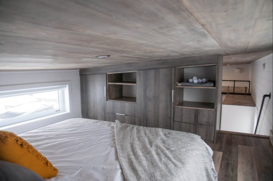 a wood-clad bedroom