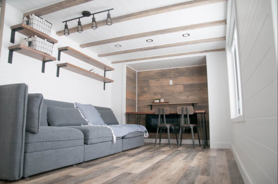 tiny home living space with grey sofa