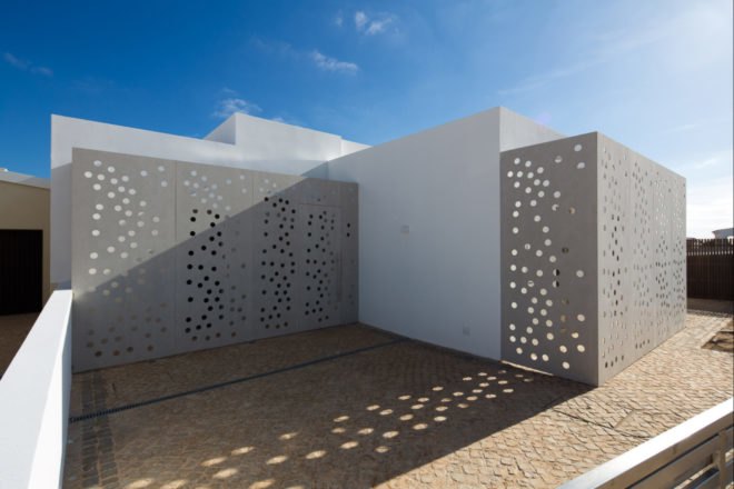 perforated walls of white building