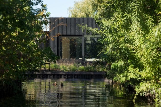 all black home next to water