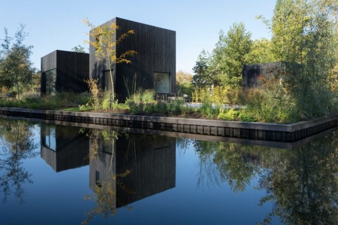 all black home next to water