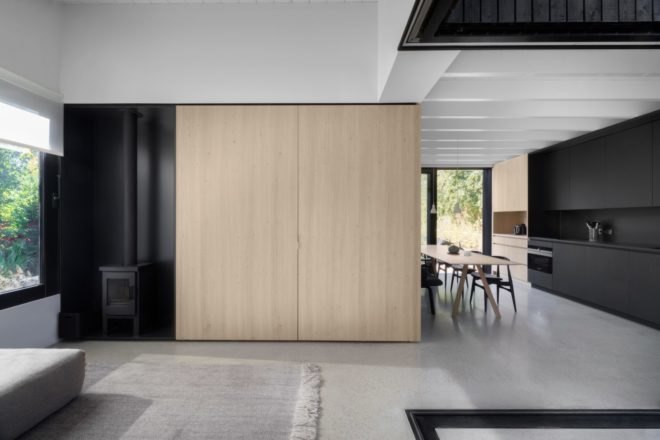 an entertainment center that slides open and closed