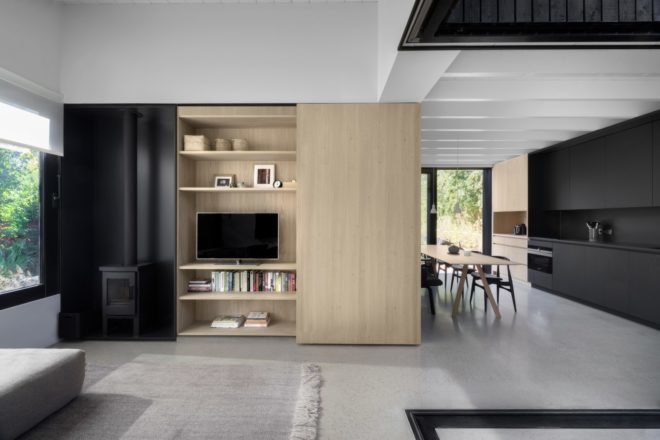 an entertainment center that slides open and closed