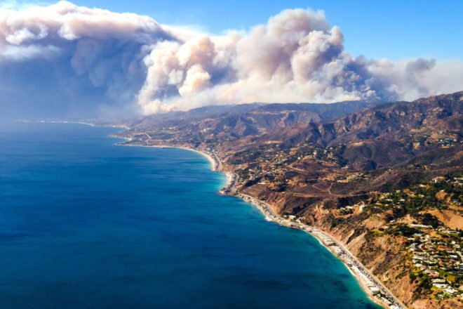 Smoke from Woolsey fire rising over California mountains and Pacific Ocean