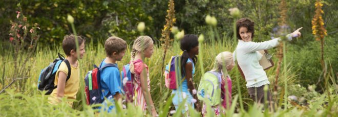 teacher and kids on a nature walk