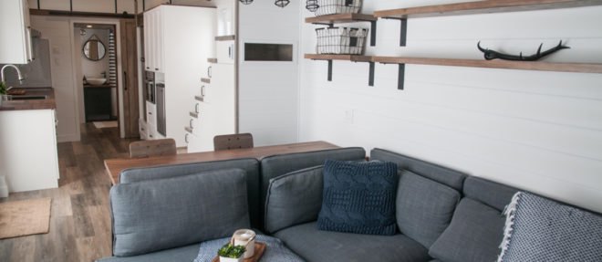 grey sofa with blanket and tray