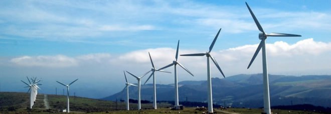 windmills with mountains in background
