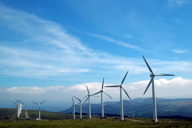 windmills with mountains in background