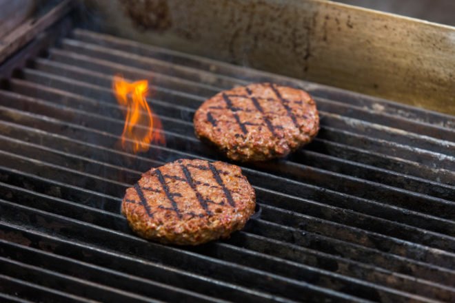 plant-based burgers on a grill