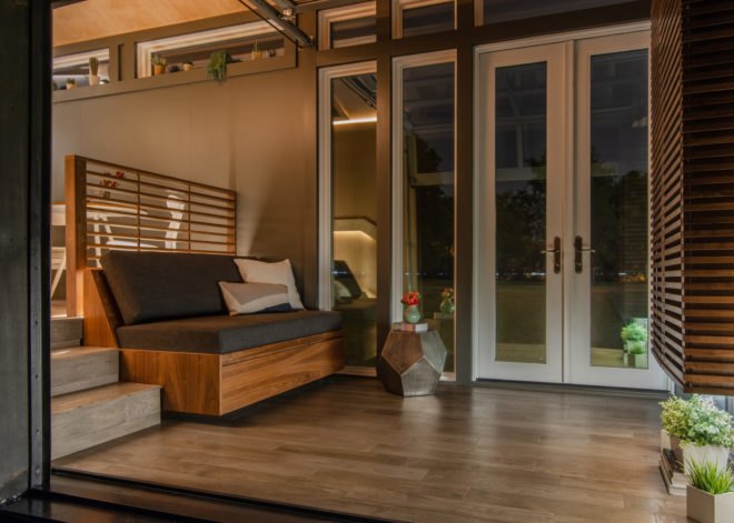 tiny home interior at night with gray sofa