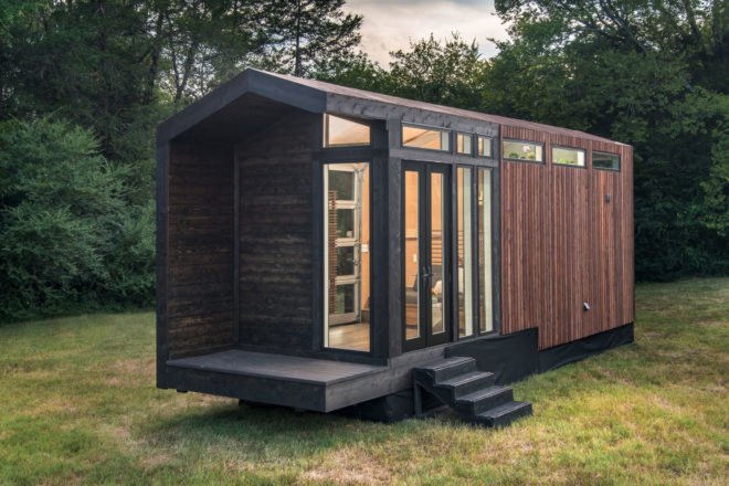 black and dark wood tiny home