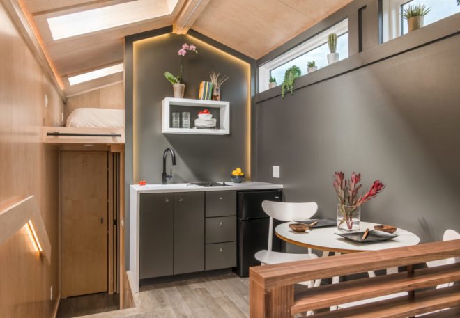 tiny kitchen with small stove and sink