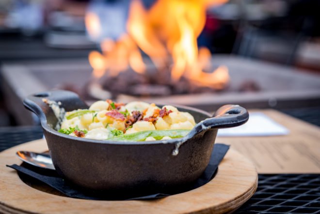 skillet with food in front of fire