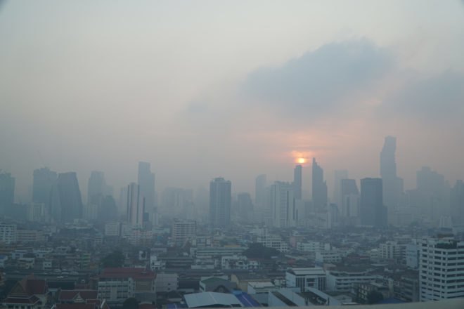 hazy gray skies over Bangkok skyline