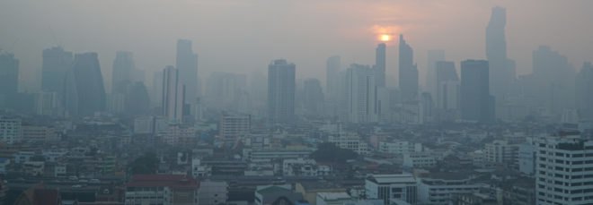 hazy gray skies over Bangkok skyline