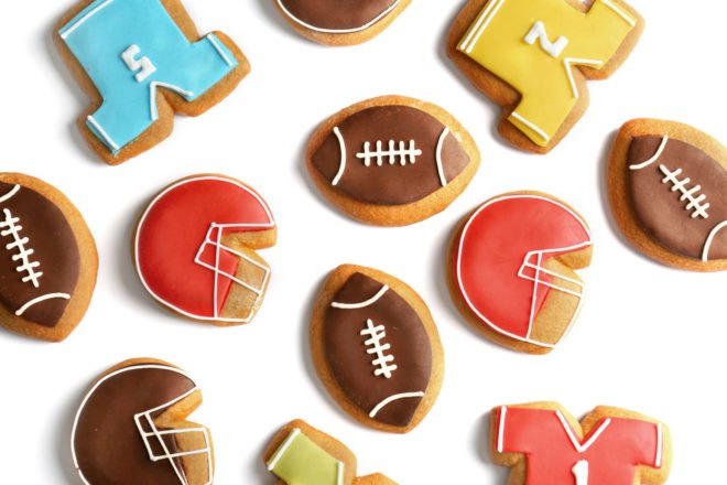 cookies in shape of jerseys and helmets