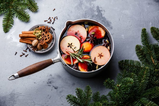 pot filled with red wine, apples and star anise