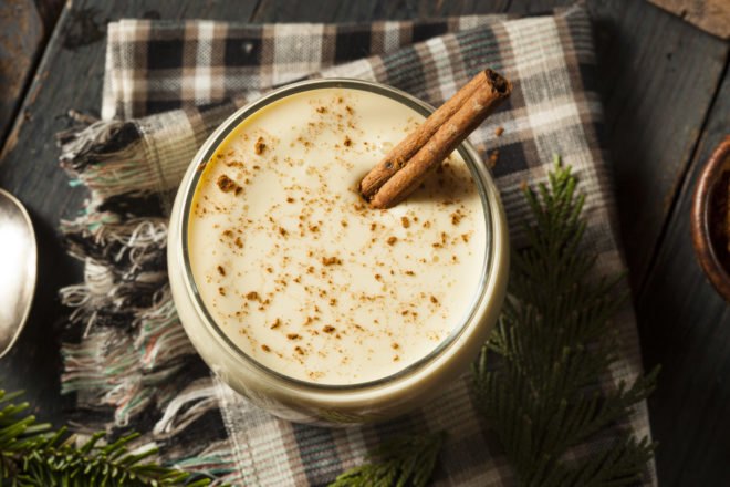 mug with spiced nog and a cinnamon stick