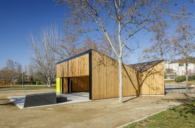 wood classroom building with open garage-style door