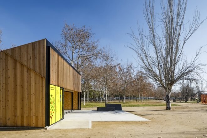 wood classroom building with large patio in front