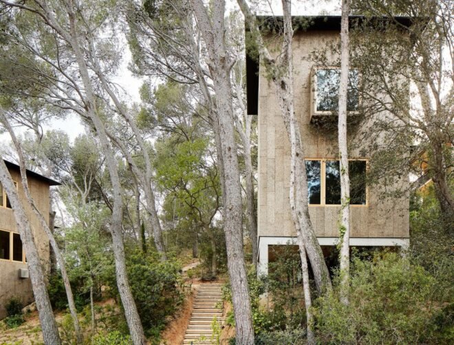 a large cork-clad home built on steep terrain