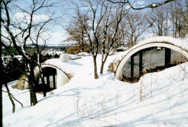 two arched structures covered in snow