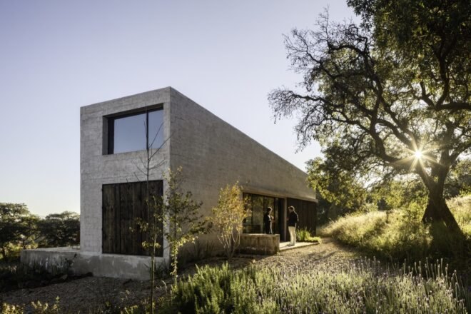 gray stone home with sloped roof