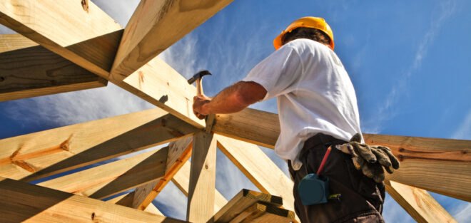 man building a house