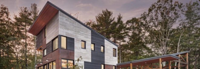 exterior of home surrounded by forest