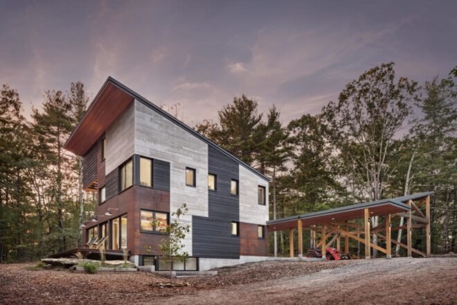 exterior of home surrounded by forest
