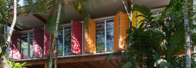home exterior with colorful window shades