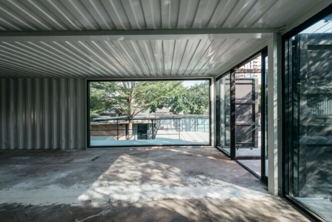 interior of shipping container building with white walls