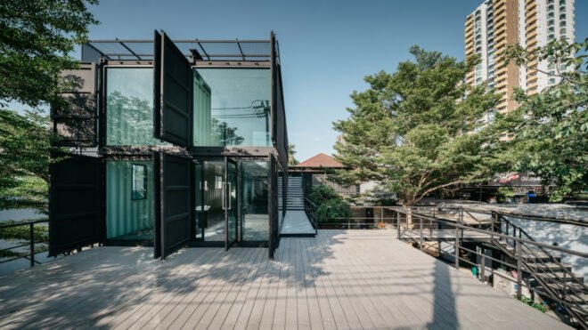 two shipping containers with upper level deck