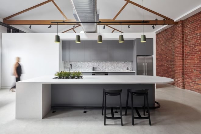 brick and white walls in the interior of the warehouse with metal furnishings