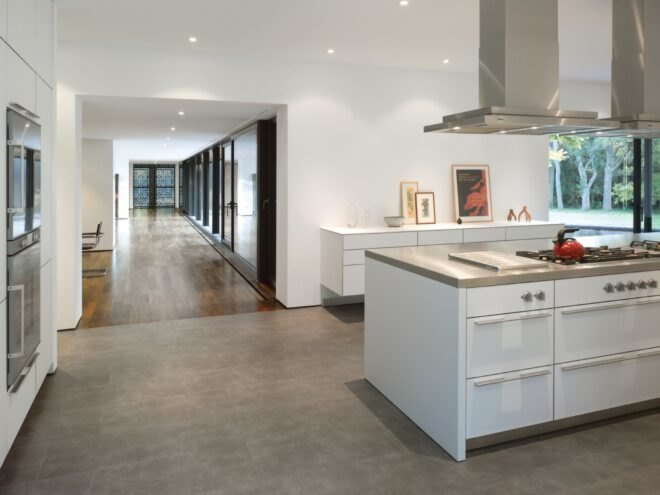 white kitchen with stainless steel countertops