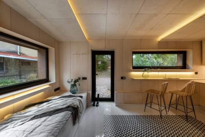 tiny interior living space with wooden walls and recessed lighting