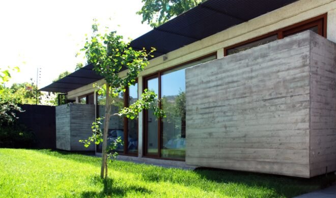 grassy yard outside concrete home