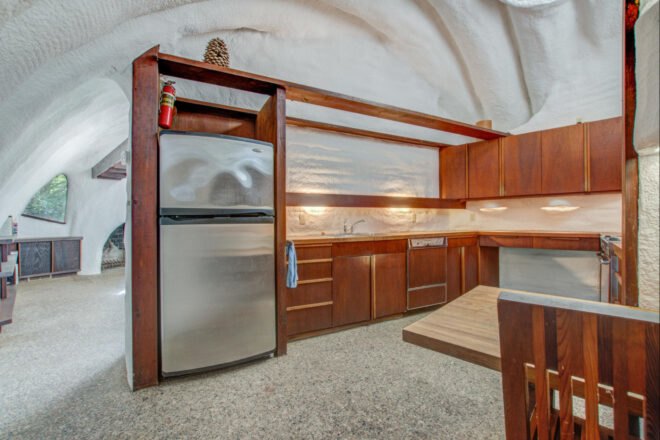 Kitchen with curved roof and wooden cabinets