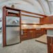 Kitchen with curved roof and wooden cabinets