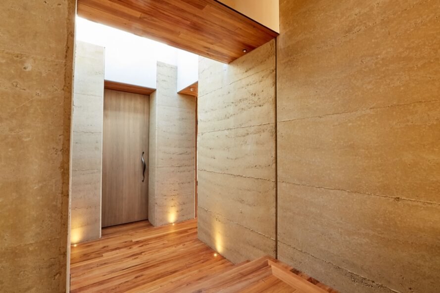 hallway of rammed earth home