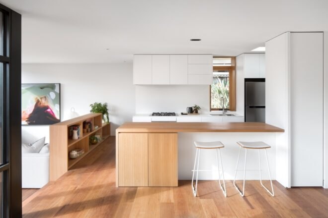 white kitchen with wood island