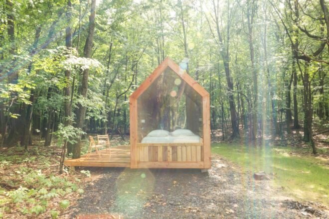 tiny wood cabin with wooden deck