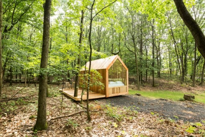 tiny cabin with gabled roof and glazed wall