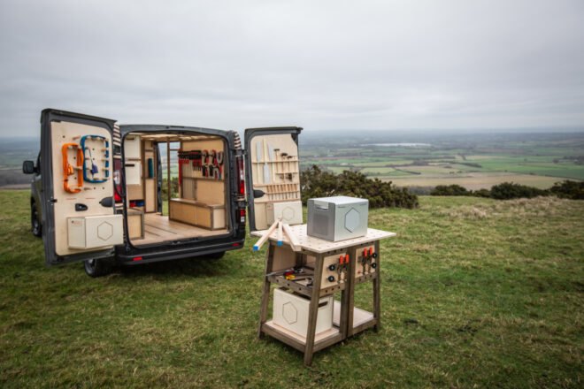 mobile woodworking shop with table out front