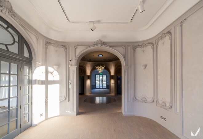 elegant features adorn the interior of the office building with detailed floor designs and lighting