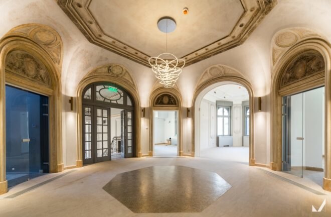 elegant features adorn the interior of the office building with detailed floor designs and lighting