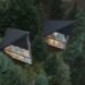 aerial view of triangular black treehouses