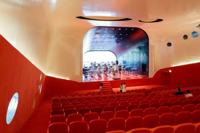 auditorium with red seats and floors
