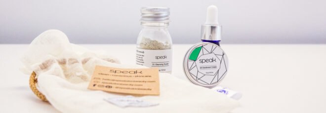 reusable pouch, glass jar, blue amber bottle and metal tin of skincare